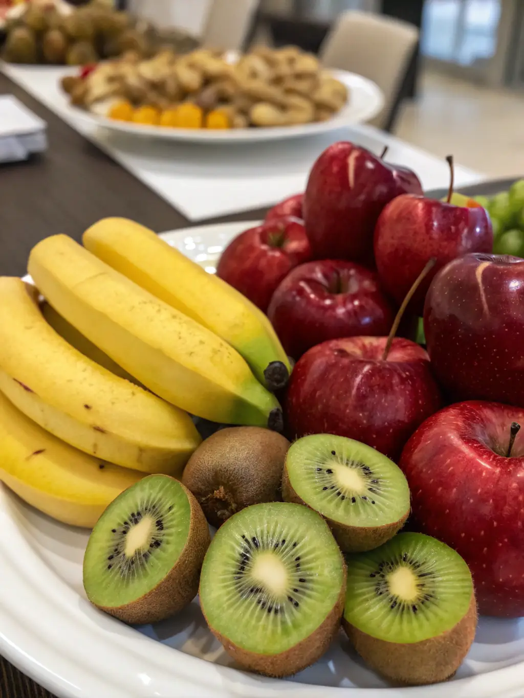 A colorful assortment of fresh fruits such as crisp red apples, juicy yellow mangoes, and bright oranges, displayed in a way that highlights their natural sweetness and vibrant colors.
